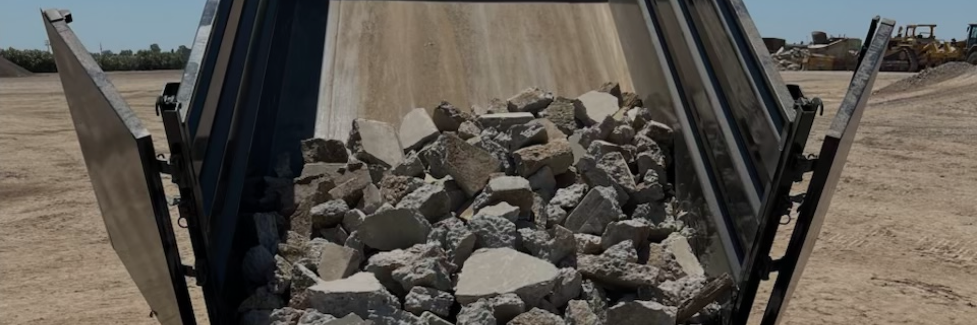 concrete sidewalk being removed with a jackhammer