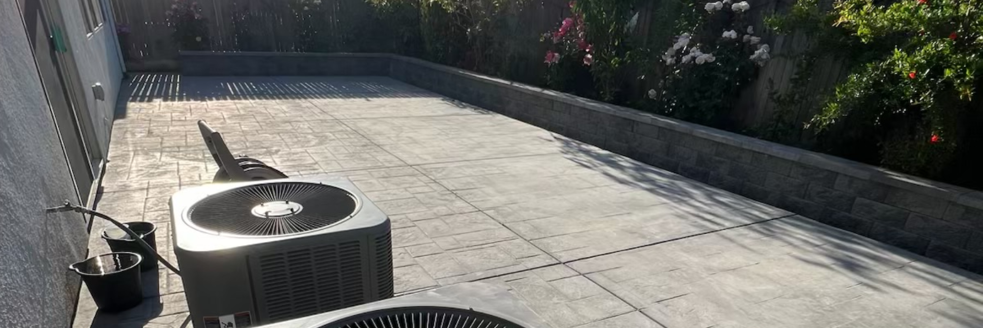 A driveway with stamped concrete laid at a 45 degree angle